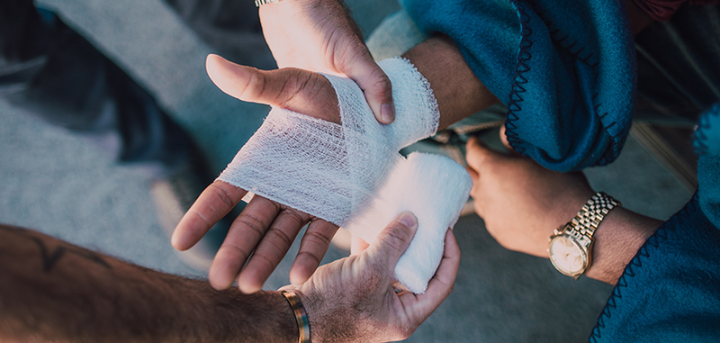 Bandaged hand.