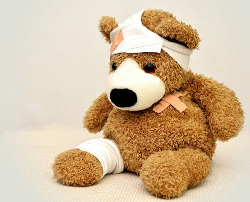 Bandaged teddy bear.
