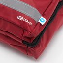 Maroon zippered bag with reflective stripe.