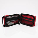 Open red first aid kit.