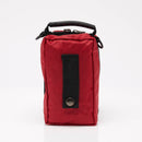 Red zippered first aid bag with black handle.