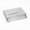 Stacked silver emergency blankets.