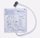 Defibrillator pads in sealed packaging with connector.