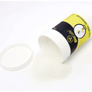 White container of body spill granules with a yellow and black label.