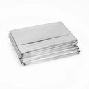 Stacked silver emergency blankets.