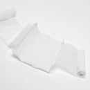 Unrolled white bandage.