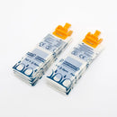 Individually wrapped adhesive bandages with orange clips.